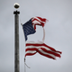 An American flag flies over the entrance to a disaster morgue holding the bodies of people who died of covid-19 at South Brooklyn Marine Terminal in New York City.